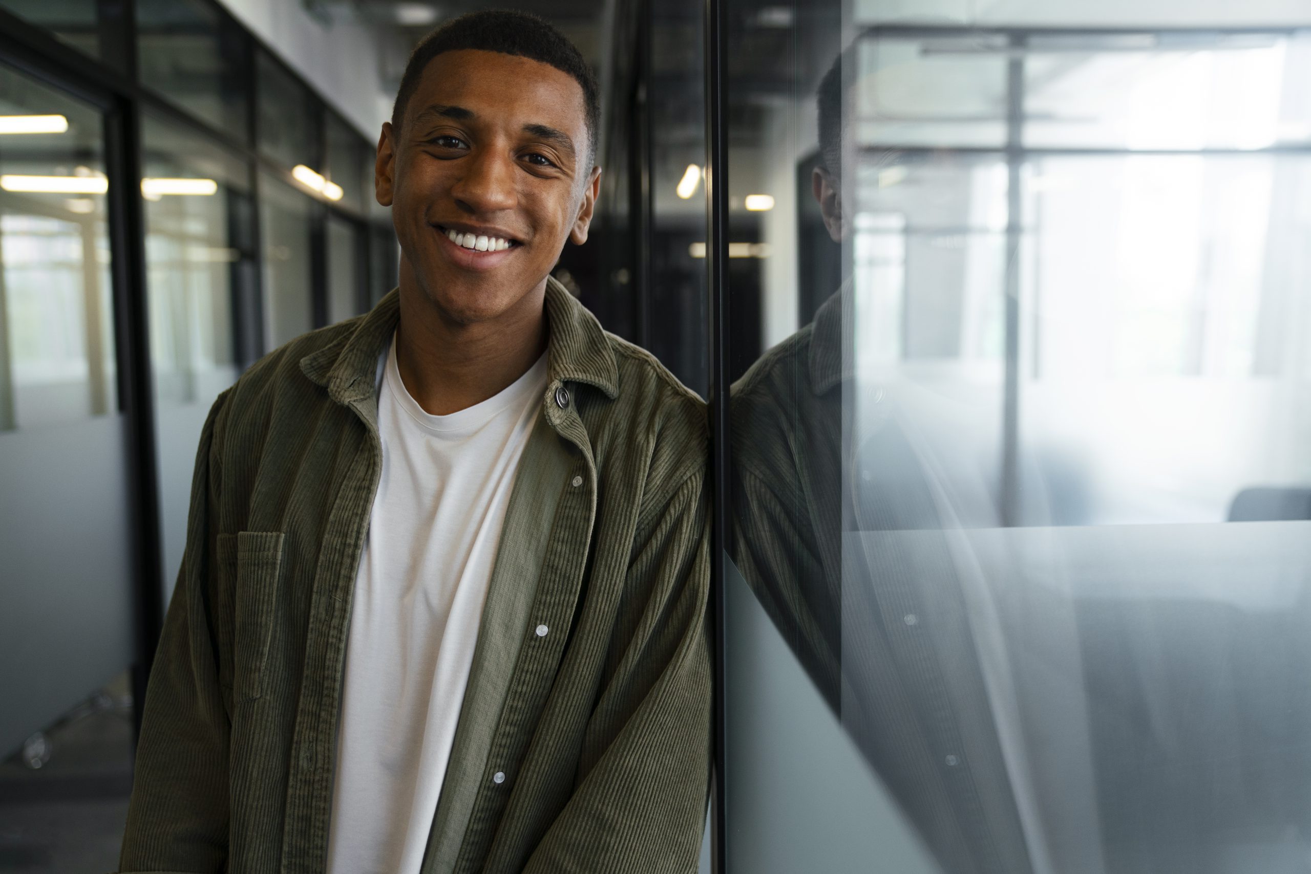 smiling-man-his-work-time-office-job